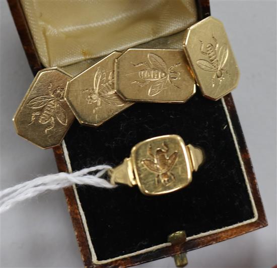 A 1930s 18ct gold signet ring carved with masonic bee and a pair of similar 9ct gold cufflinks.